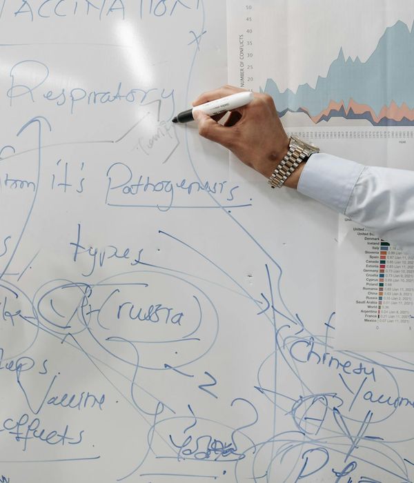 Executive team engaged in strategic planning session with data visualization