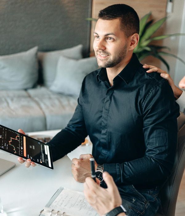 Modern office environment with team analyzing financial data